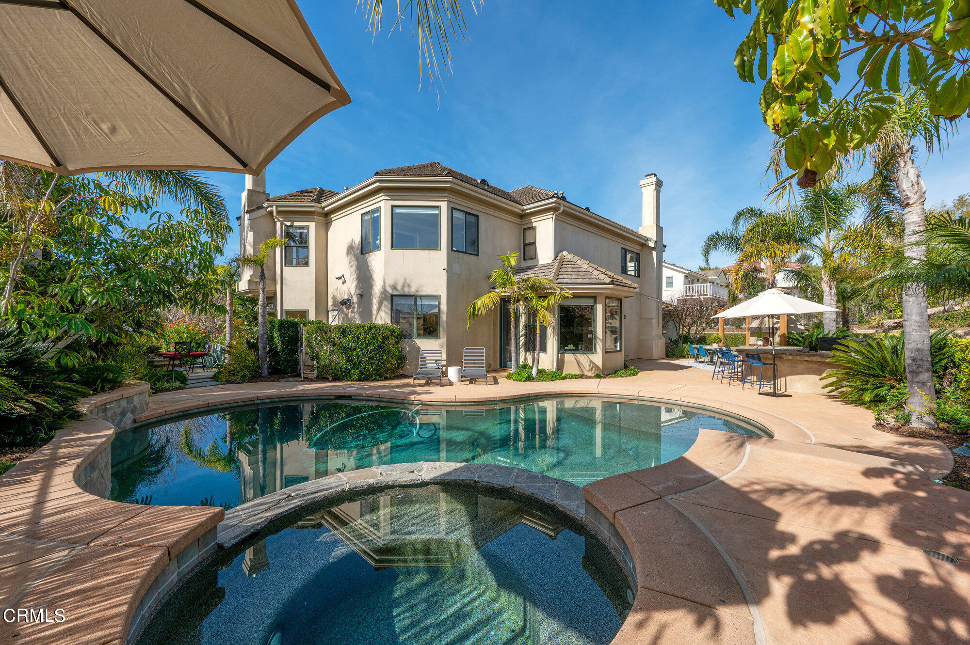 7159 Los Coyotes Place Camarillo, CA 93012 - Photo 11 of 73 a house with swimming pool in front of it