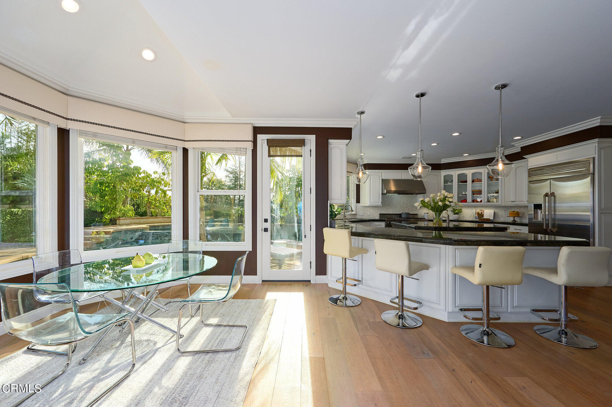 7159 Los Coyotes Place Camarillo, CA 93012 - Photo 15 of 73 a living room with stainless steel appliances kitchen island granite countertop furniture a large window and a sink