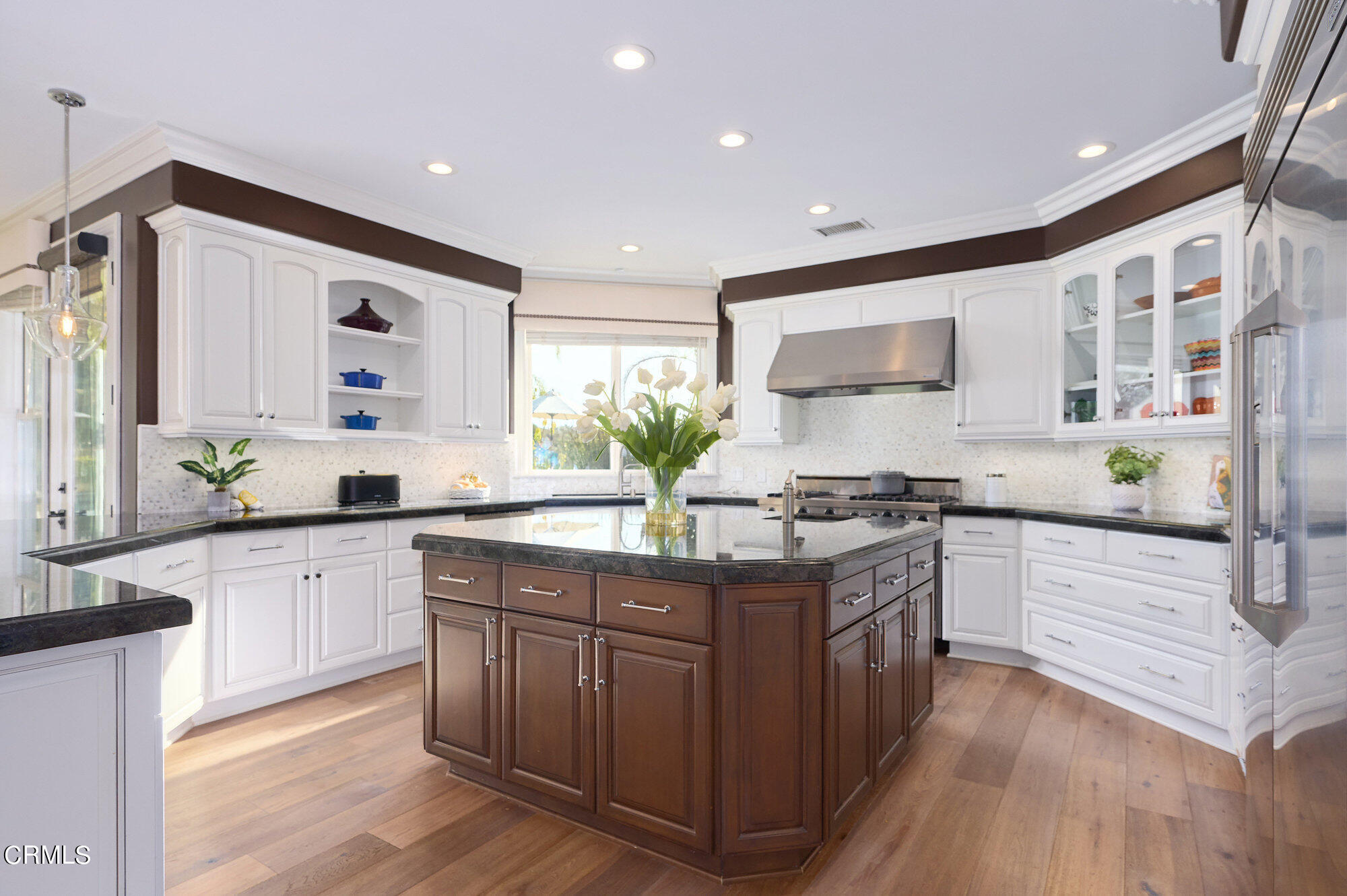 7159 Los Coyotes Place Camarillo, CA 93012 - Photo 16 of 73 a kitchen with stainless steel appliances granite countertop wooden cabinets and white stove top oven