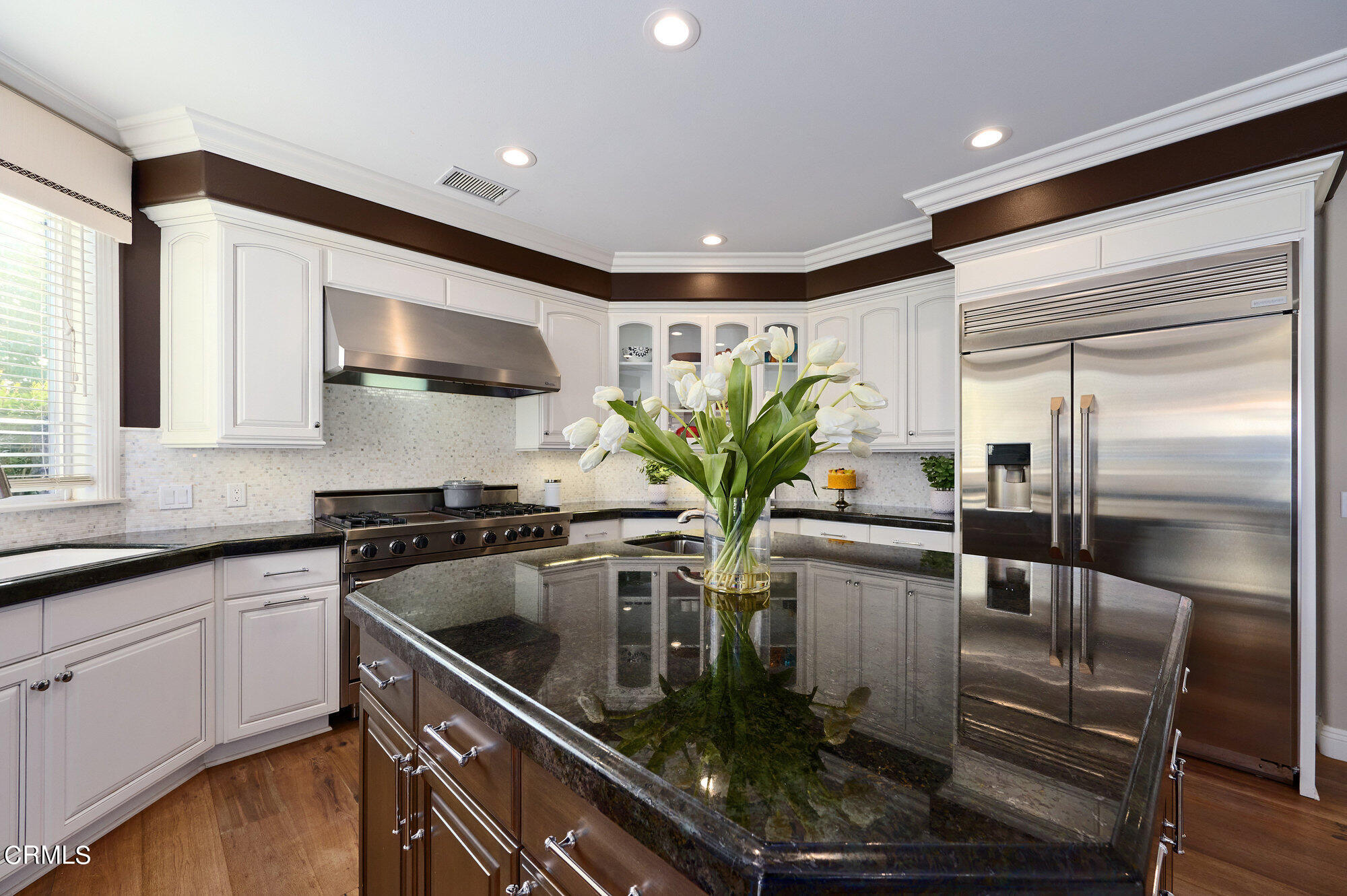 7159 Los Coyotes Place Camarillo, CA 93012 - Photo 19 of 73 a kitchen with stainless steel appliances granite countertop a sink a stove and a refrigerator