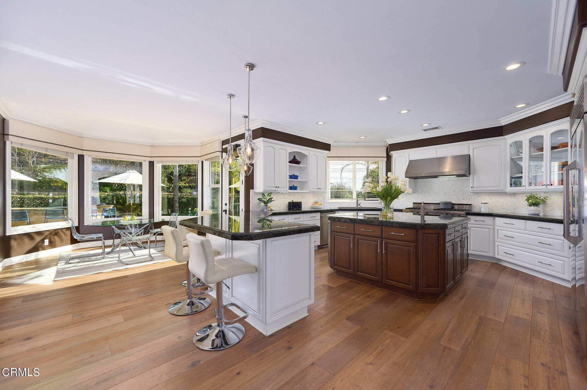 7159 Los Coyotes Place Camarillo, CA 93012 - Photo 2 of 73 a kitchen with a sink appliances and wooden floor