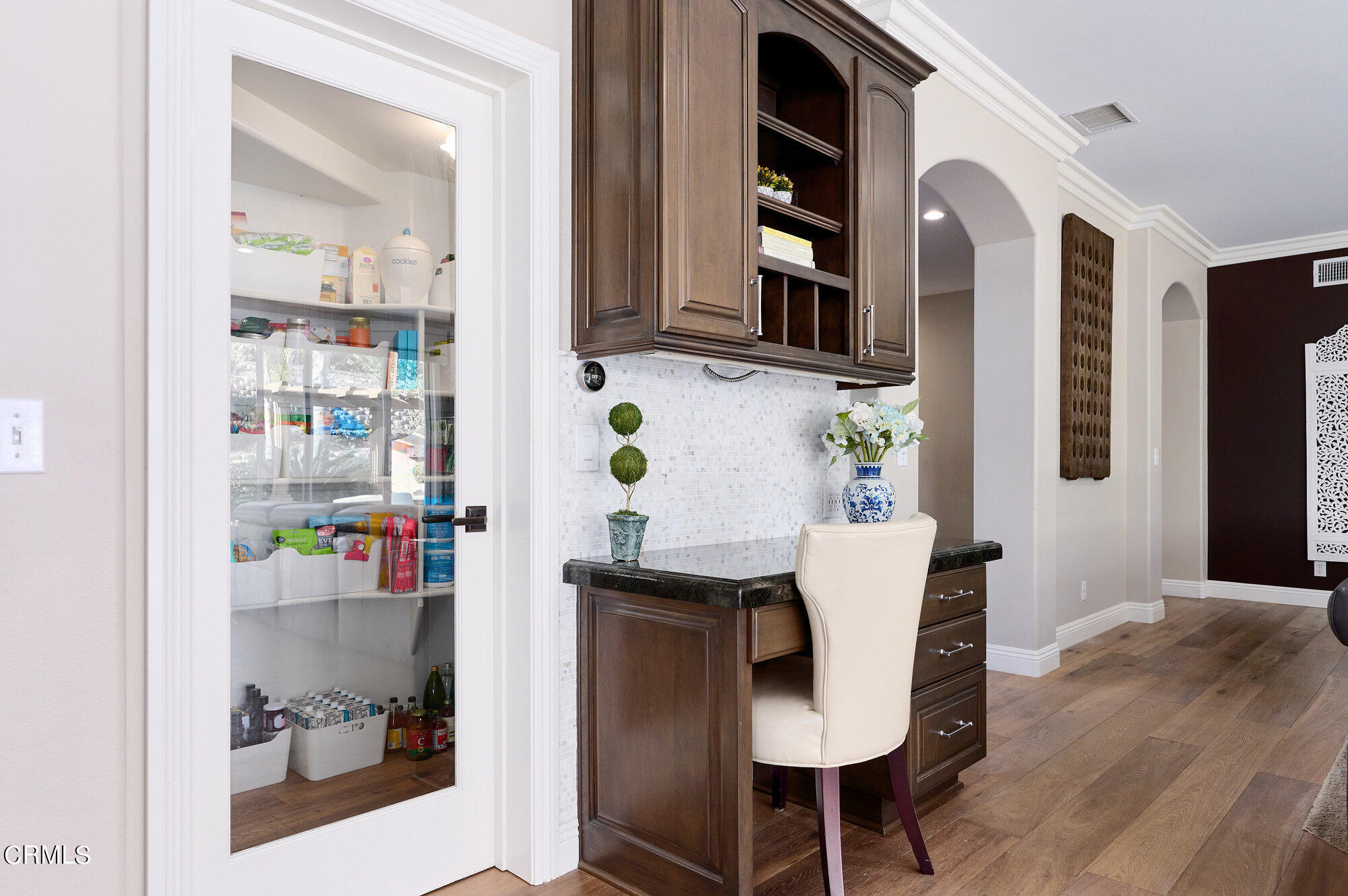7159 Los Coyotes Place Camarillo, CA 93012 - Photo 22 of 73 a view of a dining room with furniture and a potted plant
