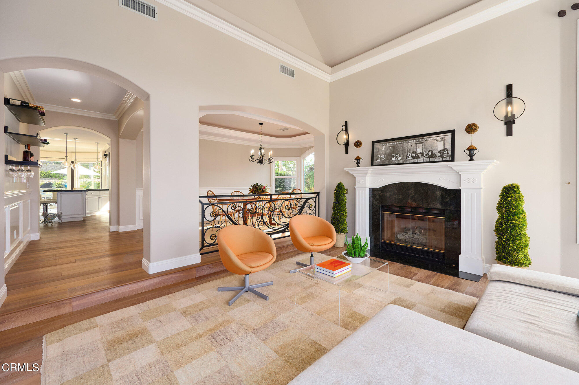 7159 Los Coyotes Place Camarillo, CA 93012 - Photo 28 of 73 a living room with furniture a fireplace and a floor to ceiling window