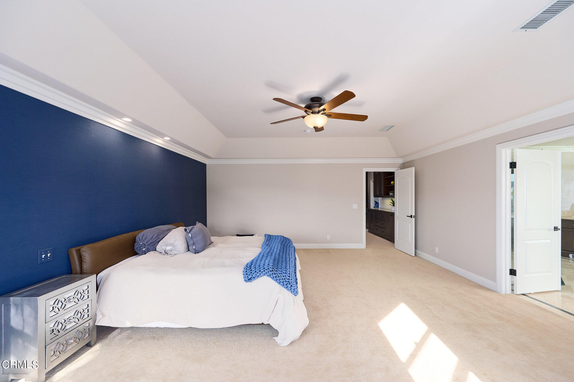 7159 Los Coyotes Place Camarillo, CA 93012 - Photo 38 of 73 a bedroom with a bed and a chandelier