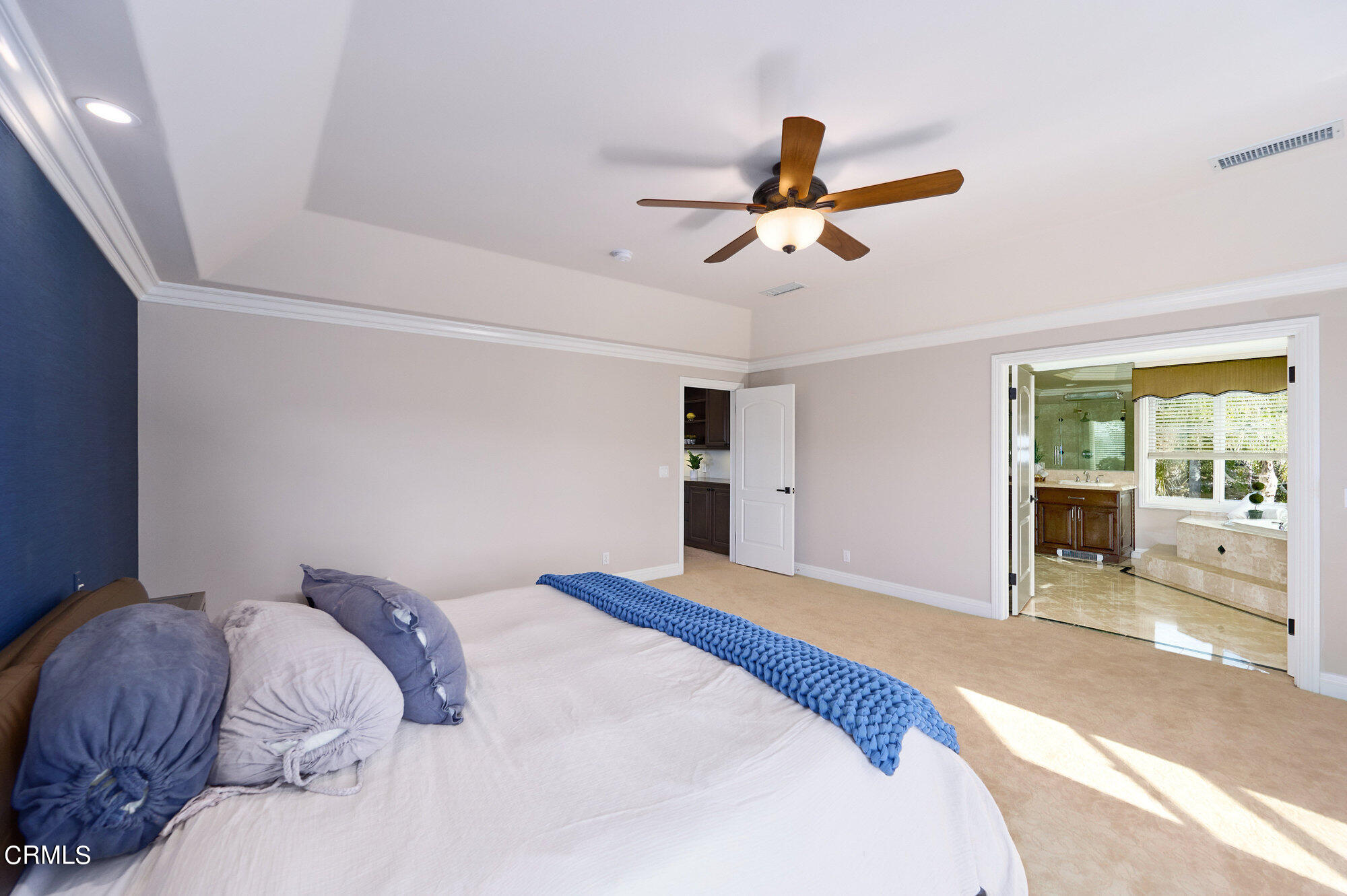 7159 Los Coyotes Place Camarillo, CA 93012 - Photo 39 of 73 a bedroom with a bed and a chandelier