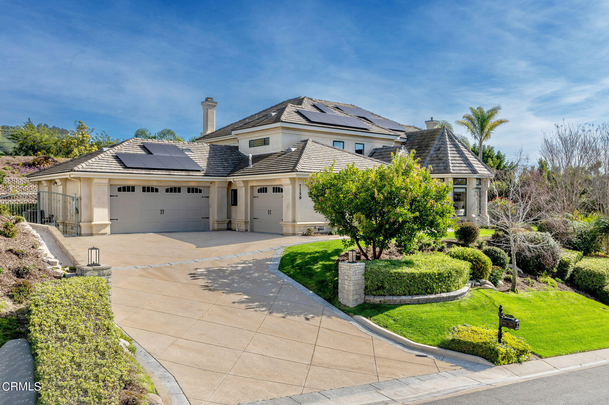 7159 Los Coyotes Place Camarillo, CA 93012 - Photo 62 of 73 a front view of a house with a garden