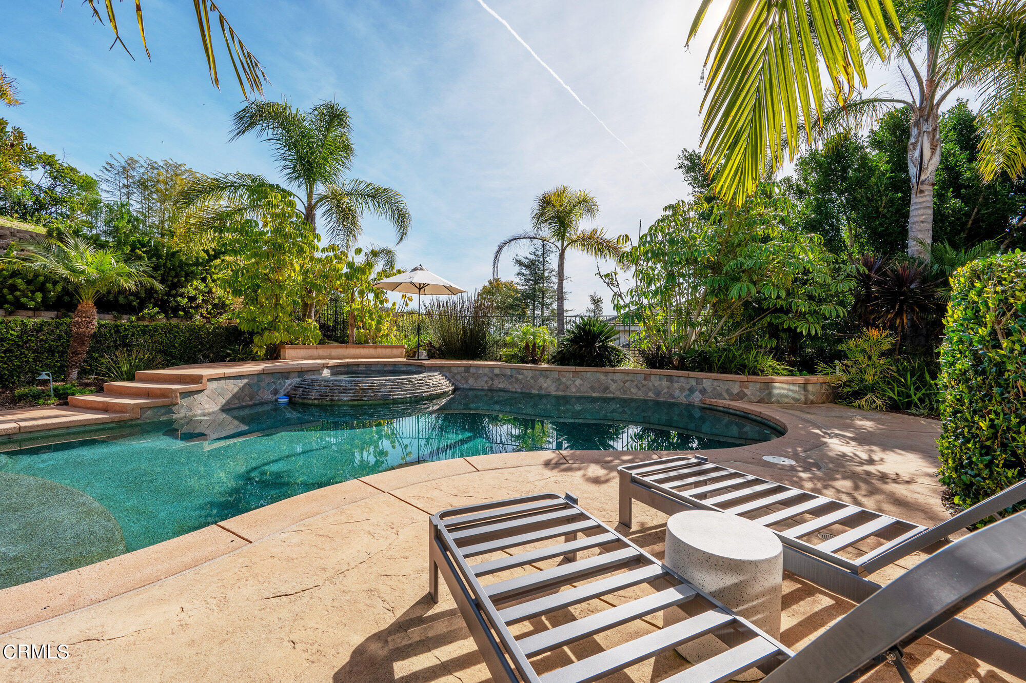 7159 Los Coyotes Place Camarillo, CA 93012 - Photo 9 of 73 a view of a patio with table and chairs potted plants and palm trees