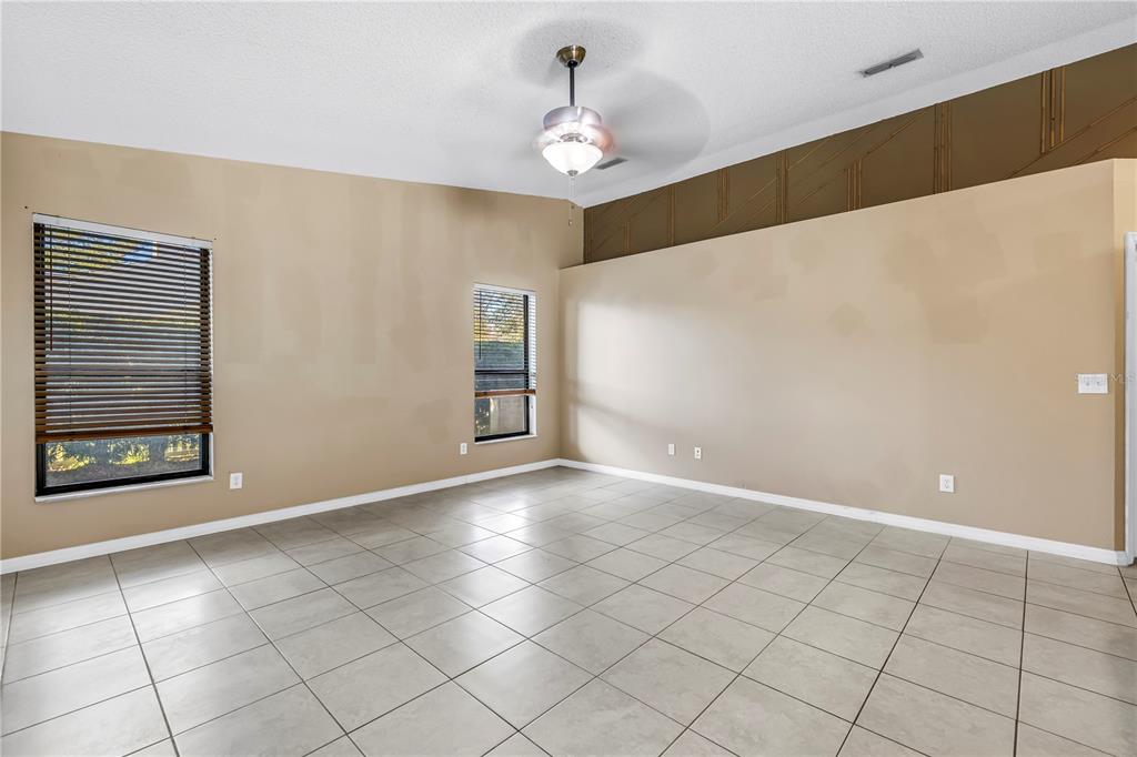 8436 Ridgebrook Circle Odessa, FL 33556 - Photo 11 of 58 a view of an empty room with window and cabinet