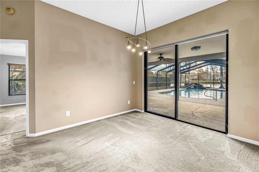 8436 Ridgebrook Circle Odessa, FL 33556 - Photo 17 of 58 en empty room with sliding glass door shower and furniture