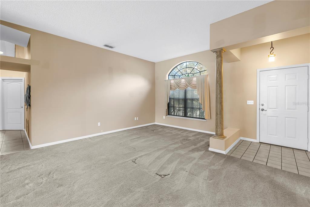 8436 Ridgebrook Circle Odessa, FL 33556 - Photo 18 of 58 an empty room with windows and painted walls