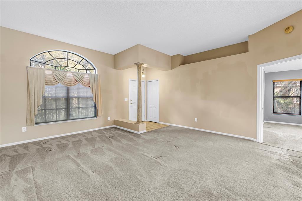 8436 Ridgebrook Circle Odessa, FL 33556 - Photo 19 of 58 an empty room with windows and mirror