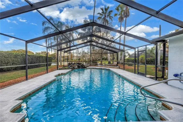 a view of a swimming pool with a porch
