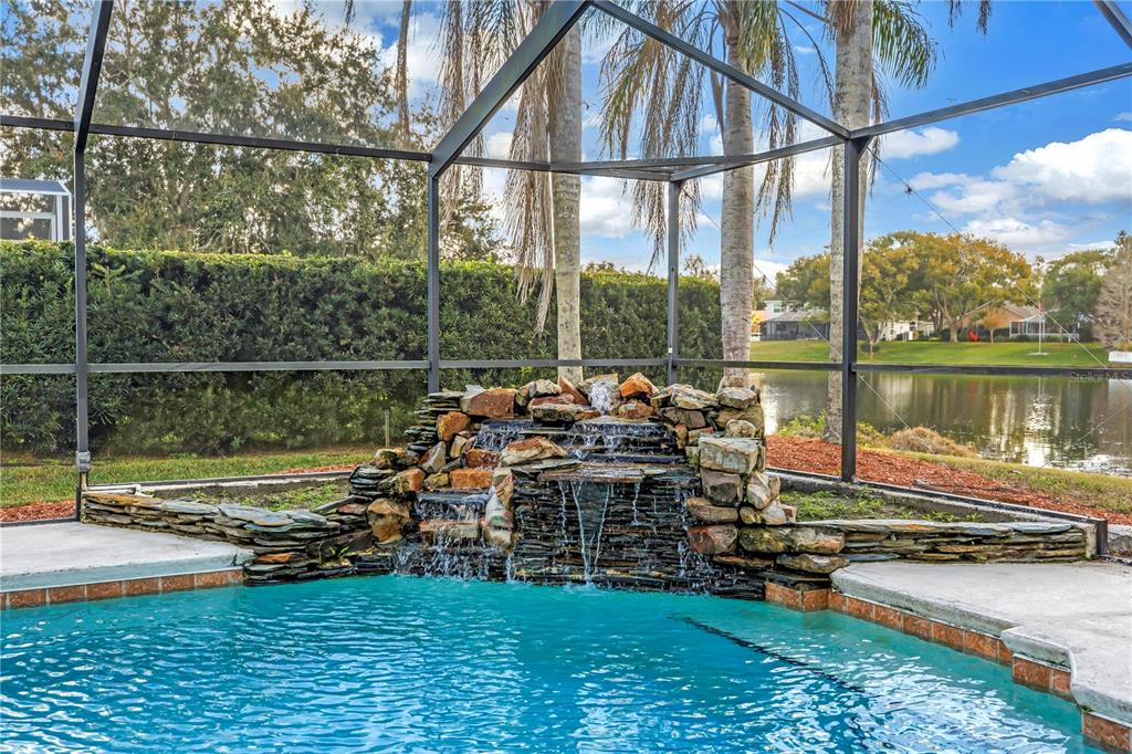 8436 Ridgebrook Circle Odessa, FL 33556 - Photo 30 of 58 a view of a lake with couches chairs and city view