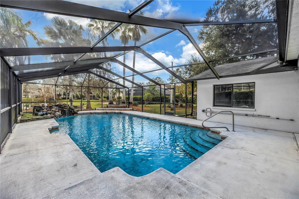 8436 Ridgebrook Circle Odessa, FL 33556 - Photo 33 of 58 a view of a swimming pool with a patio and a yard