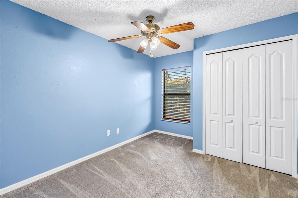 8436 Ridgebrook Circle Odessa, FL 33556 - Photo 37 of 58 an empty room with windows and fan