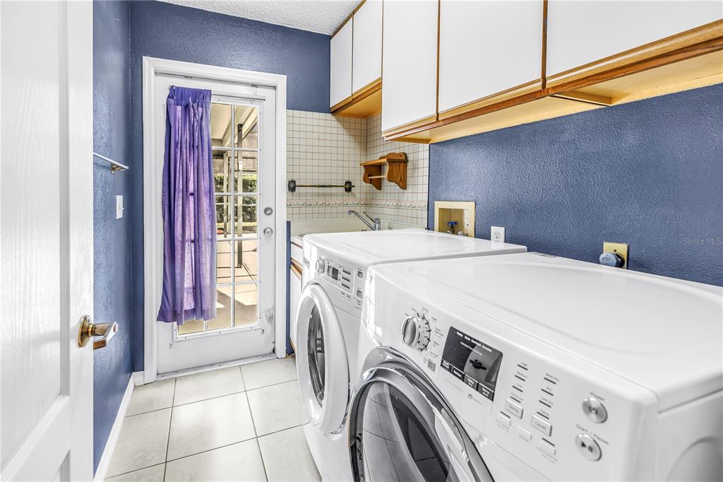 8436 Ridgebrook Circle Odessa, FL 33556 - Photo 38 of 58 a utility room with dryer and washer