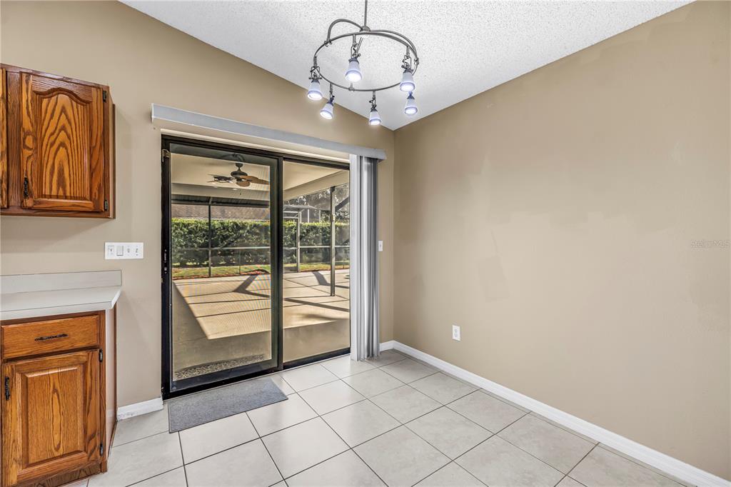 8436 Ridgebrook Circle Odessa, FL 33556 - Photo 10 of 58 a view of a livingroom with a chandelier fan and windows