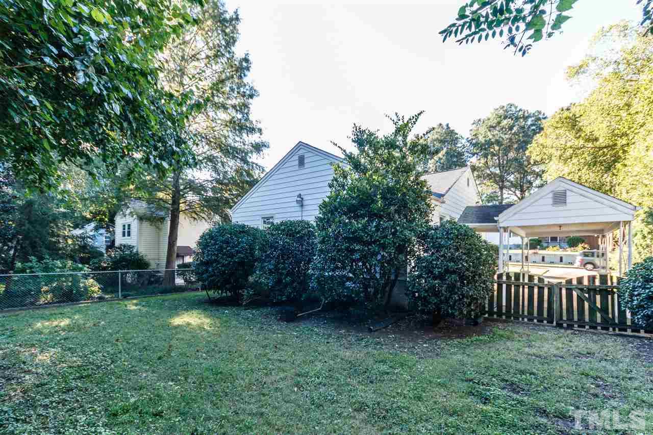 607 Frank Street Raleigh, NC 27604 - Photo 19 of 23 a view of a backyard with plants and large trees