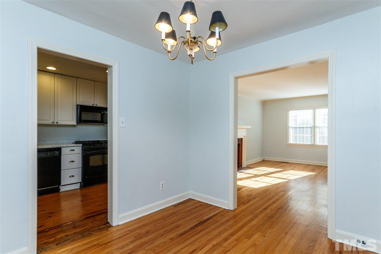 607 Frank Street Raleigh, NC 27604 - Photo 8 of 23 a view of livingroom with chandelier fan and kitchen view