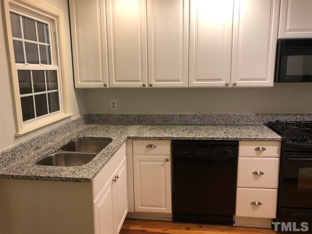 607 Frank Street Raleigh, NC 27604 - Photo 10 of 23 a kitchen with granite countertop a sink and cabinets