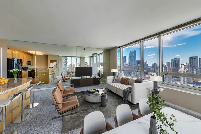 a living room with furniture and a large window