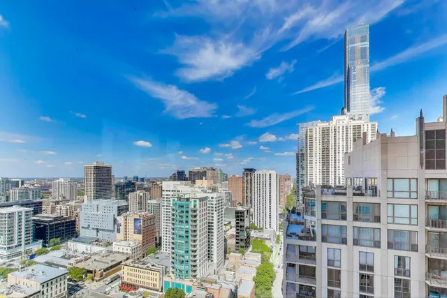 a view of a city with tall buildings
