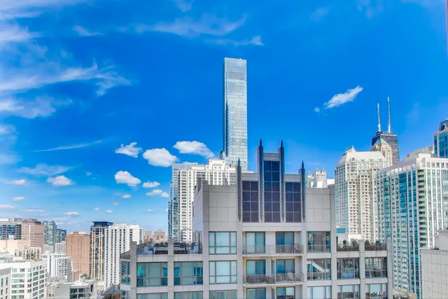 a view of a city with tall buildings