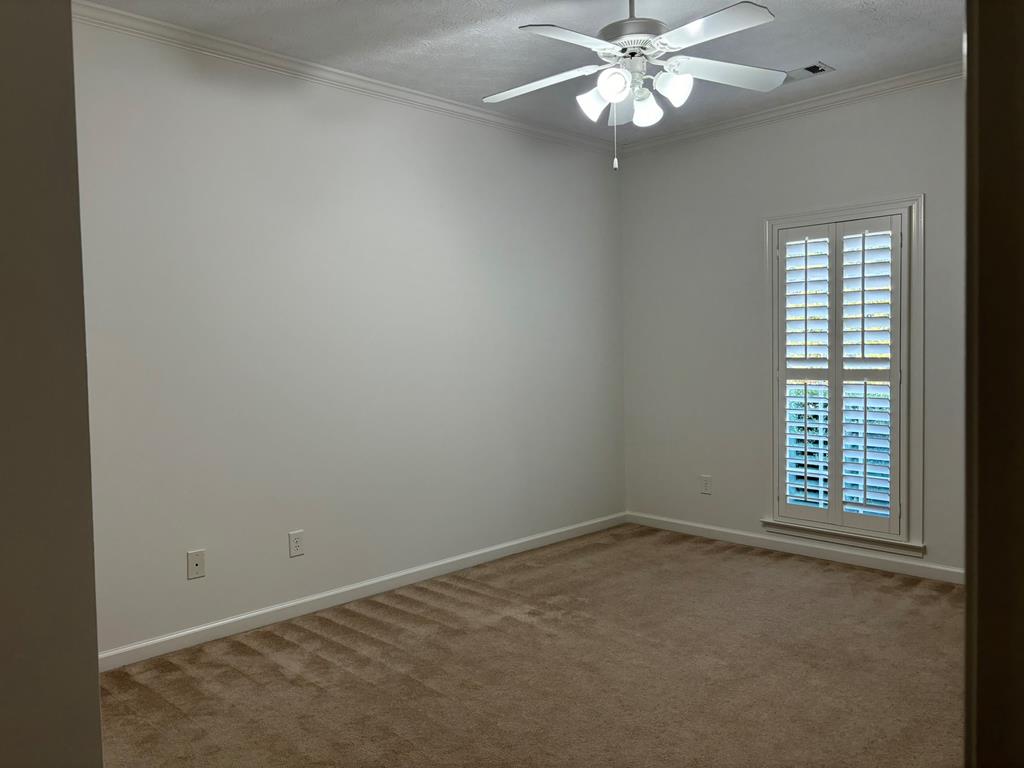 8001 Adelaide Drive Columbus, GA 31909 - Photo 25 of 36 an empty room with a window and a fan