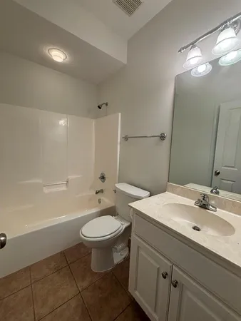 a bathroom with a sink toilet a mirror and shower