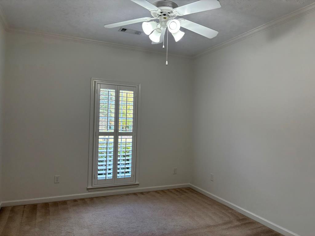 8001 Adelaide Drive Columbus, GA 31909 - Photo 27 of 36 an empty room with a window and a fan