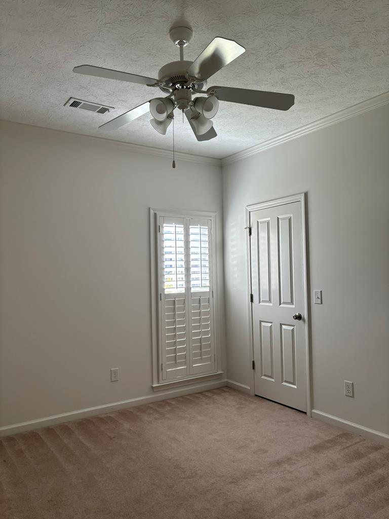 8001 Adelaide Drive Columbus, GA 31909 - Photo 34 of 36 an empty room with windows and fan