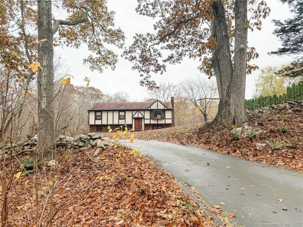 a front view of a house with a yard and pathway