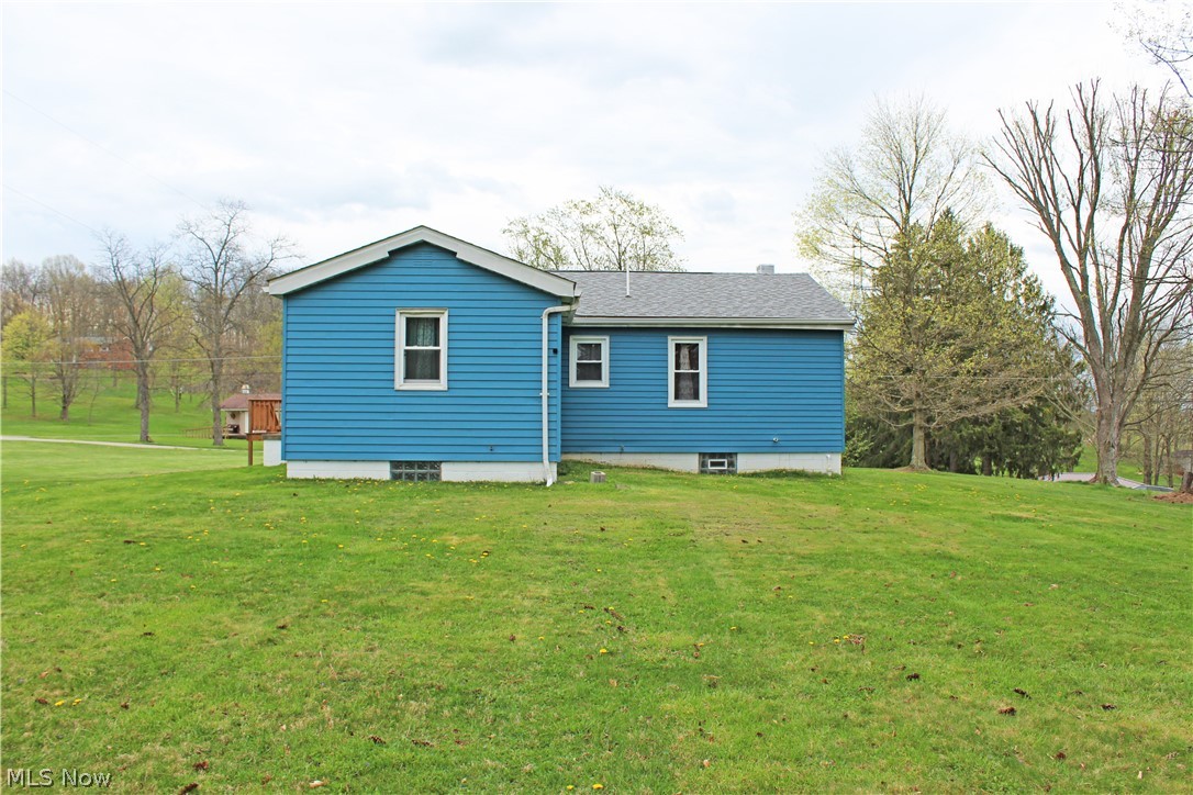 1386 Hall's Road Colliers, WV 26035 - Photo 14 of 17 Rear view of house with a yard