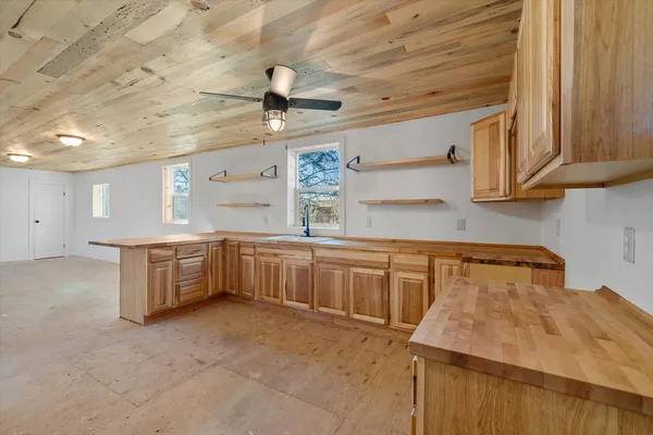 a kitchen with stainless steel appliances granite countertop a sink and cabinets