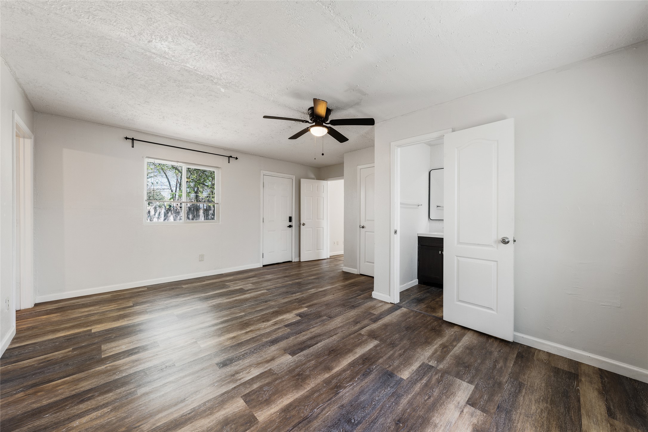 1116 Ebert Avenue, Unit B Austin, TX 78721 - Photo 15 of 28 wooden floor in an empty room with a window