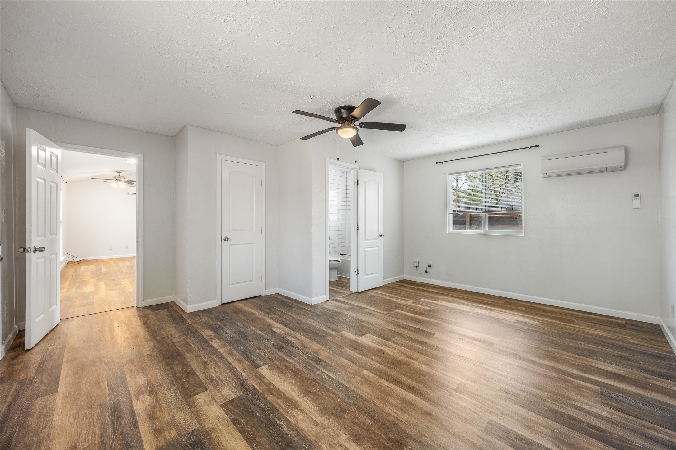 1116 Ebert Avenue, Unit B Austin, TX 78721 - Photo 17 of 28 wooden floor in an empty room with a window