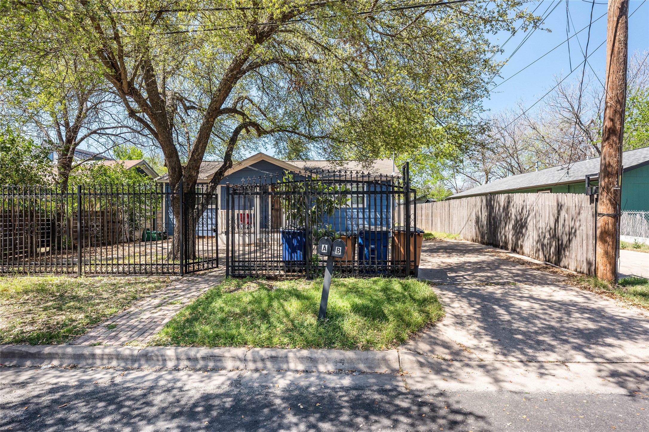 1116 Ebert Avenue, Unit B Austin, TX 78721 - Photo 2 of 28 a view of a chair and table in backyard of the house