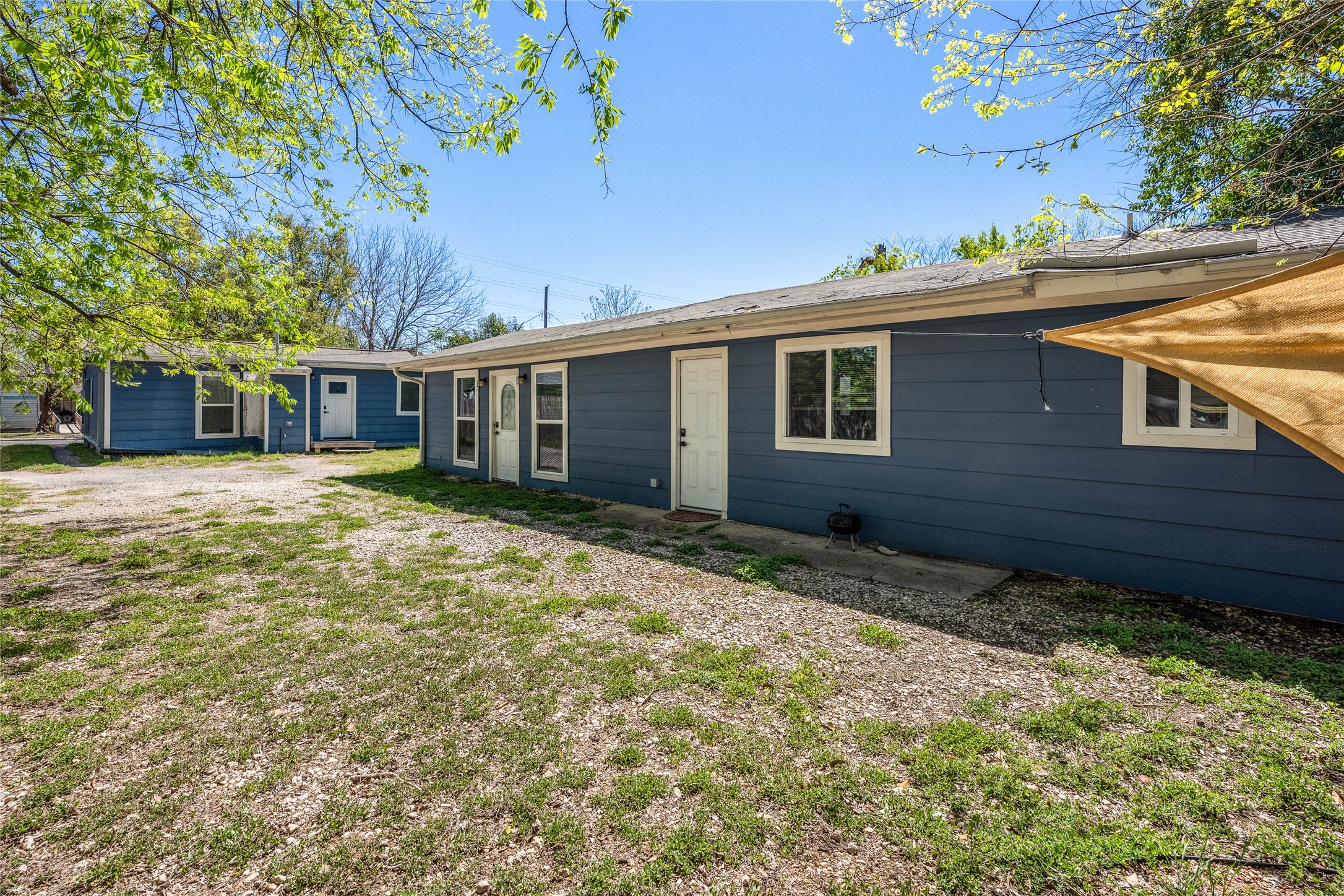1116 Ebert Avenue, Unit B Austin, TX 78721 - Photo 27 of 28 a view of a house with a yard and sitting area