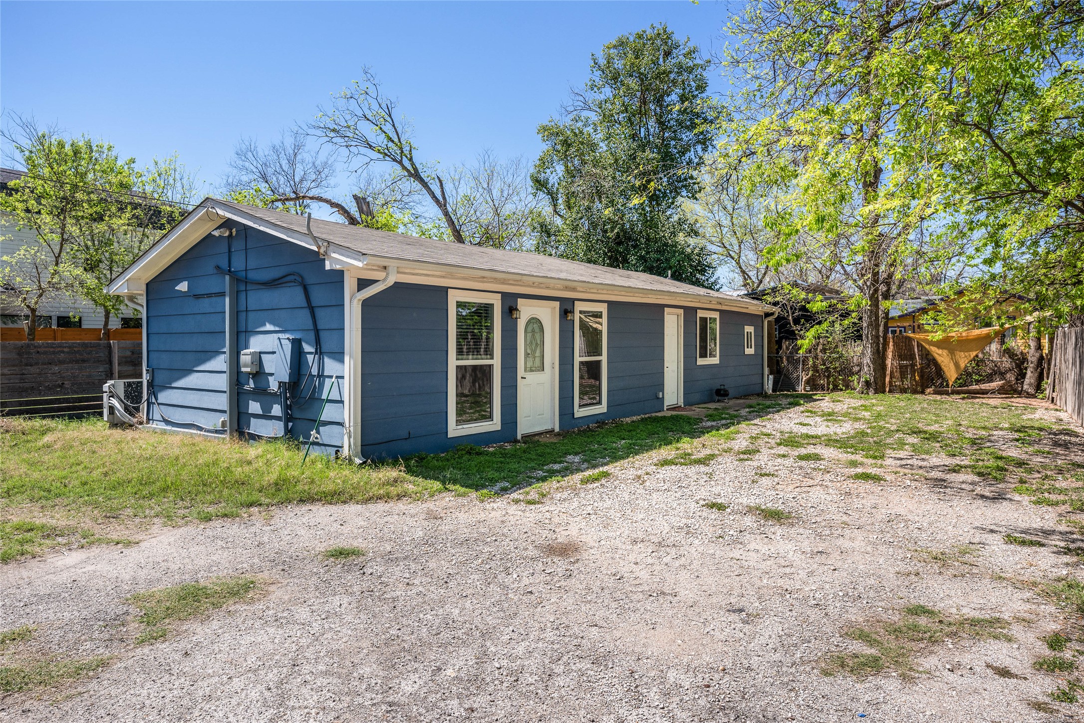 1116 Ebert Avenue, Unit B Austin, TX 78721 - Photo 3 of 28 a view of a yard in front of a house with large trees