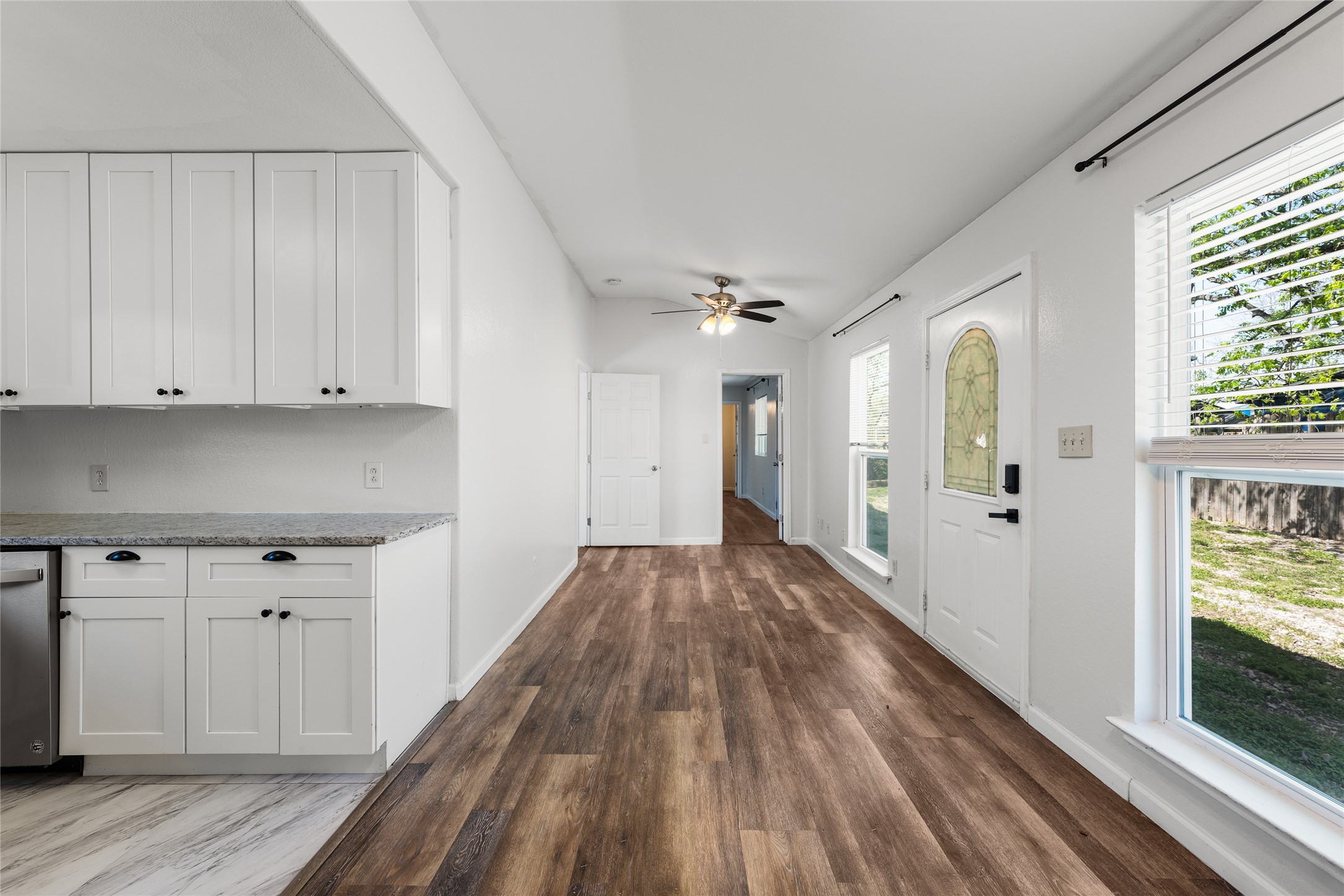 1116 Ebert Avenue, Unit B Austin, TX 78721 - Photo 6 of 28 a view of a hallway with wooden floor and cabinets