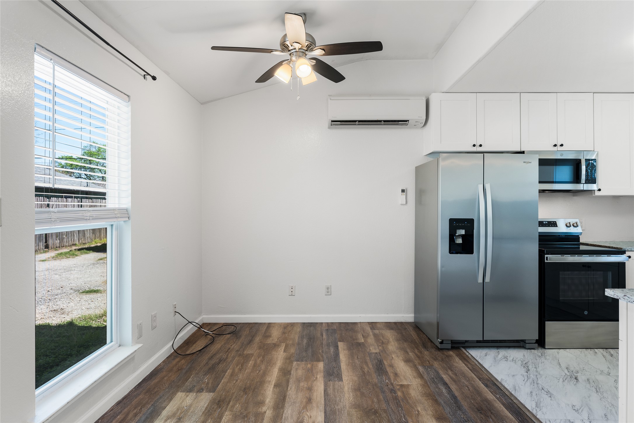 1116 Ebert Avenue, Unit B Austin, TX 78721 - Photo 8 of 28 a view of a refrigerator in kitchen and an empty room