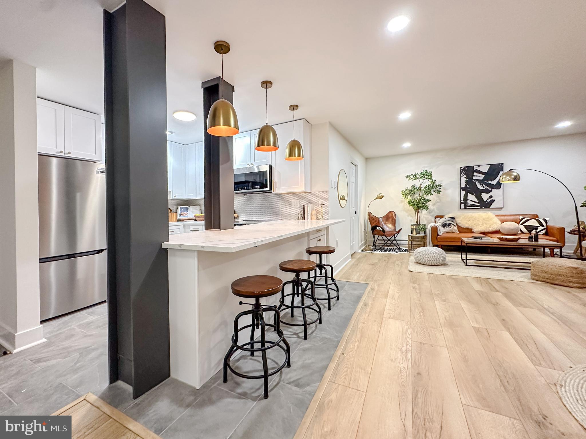 3245 Rio Drive, Unit 206 Falls Church, VA 22041 - Photo 1 of 36 a living room with furniture and kitchen view