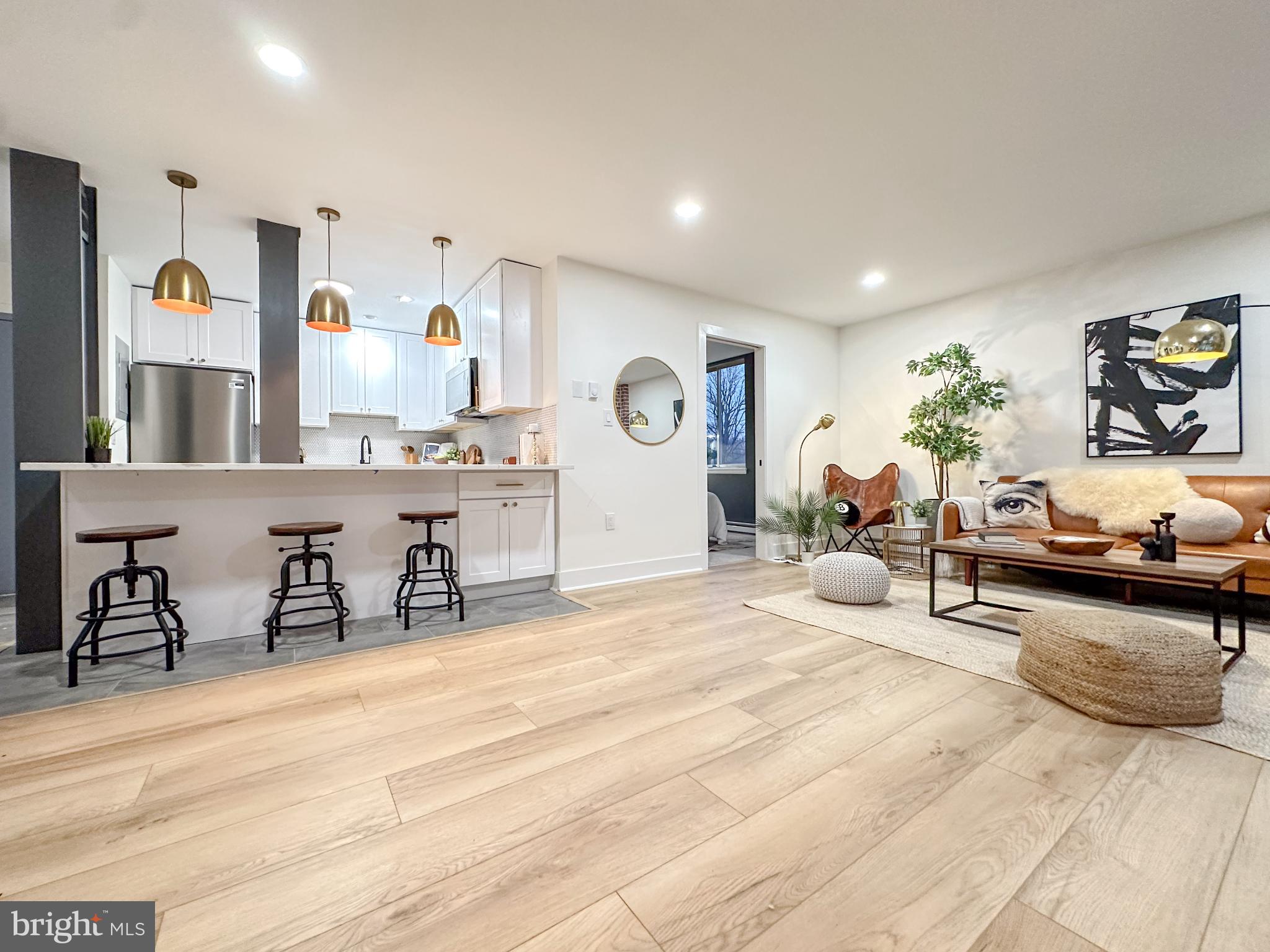 3245 Rio Drive, Unit 206 Falls Church, VA 22041 - Photo 12 of 36 a bedroom with furniture and a wooden floor
