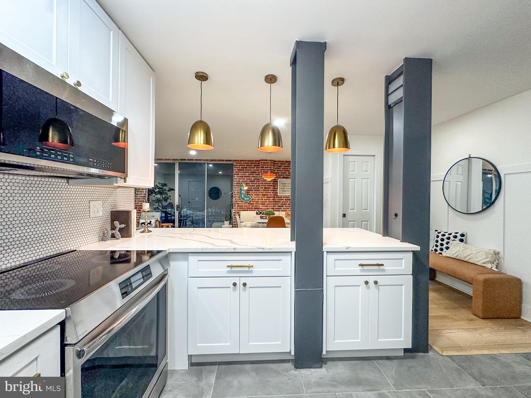 3245 Rio Drive, Unit 206 Falls Church, VA 22041 - Photo 15 of 36 a kitchen with a sink stove and cabinets