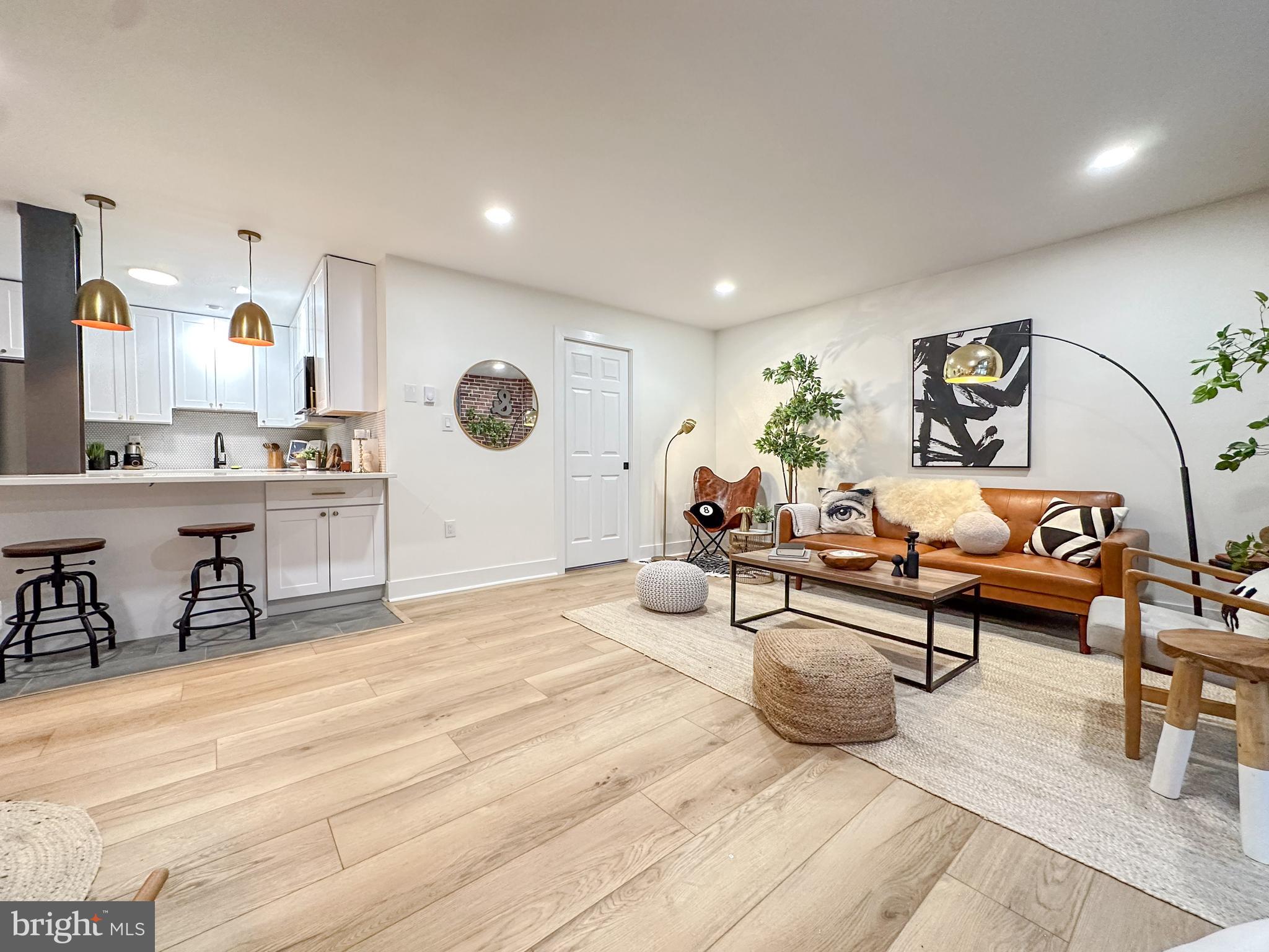 3245 Rio Drive, Unit 206 Falls Church, VA 22041 - Photo 18 of 36 a living room with furniture and a wooden floor