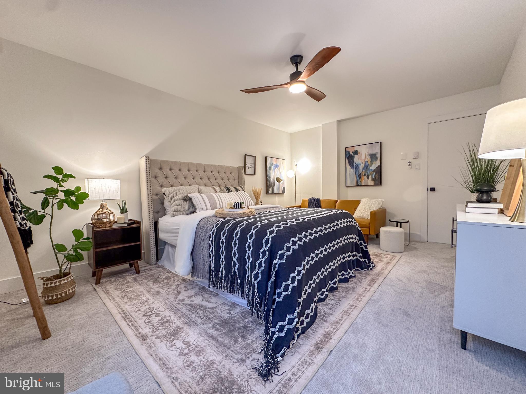 3245 Rio Drive, Unit 206 Falls Church, VA 22041 - Photo 20 of 36 a bedroom with a large bed and a chandelier