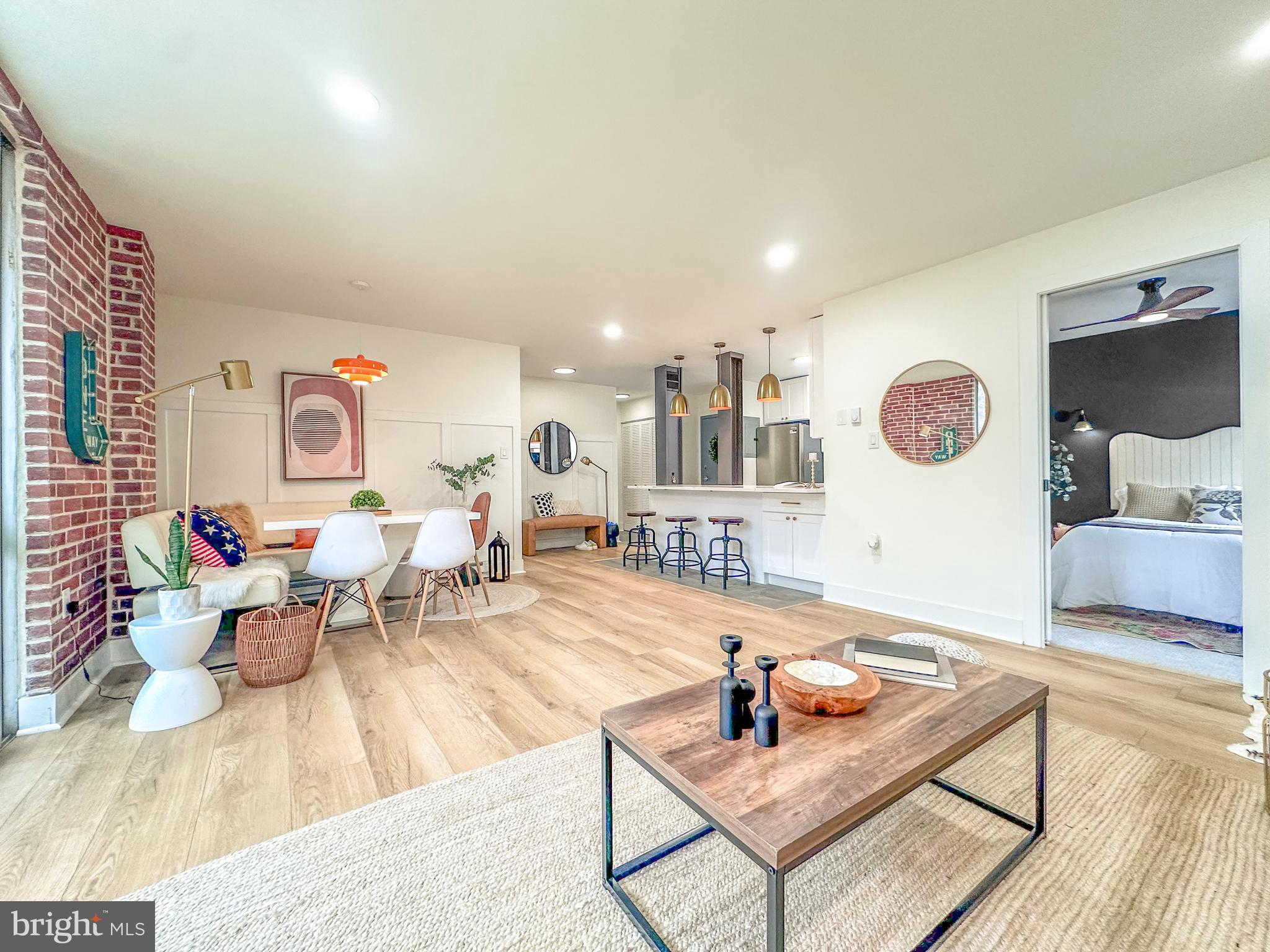 3245 Rio Drive, Unit 206 Falls Church, VA 22041 - Photo 2 of 36 a living room with furniture and wooden floor
