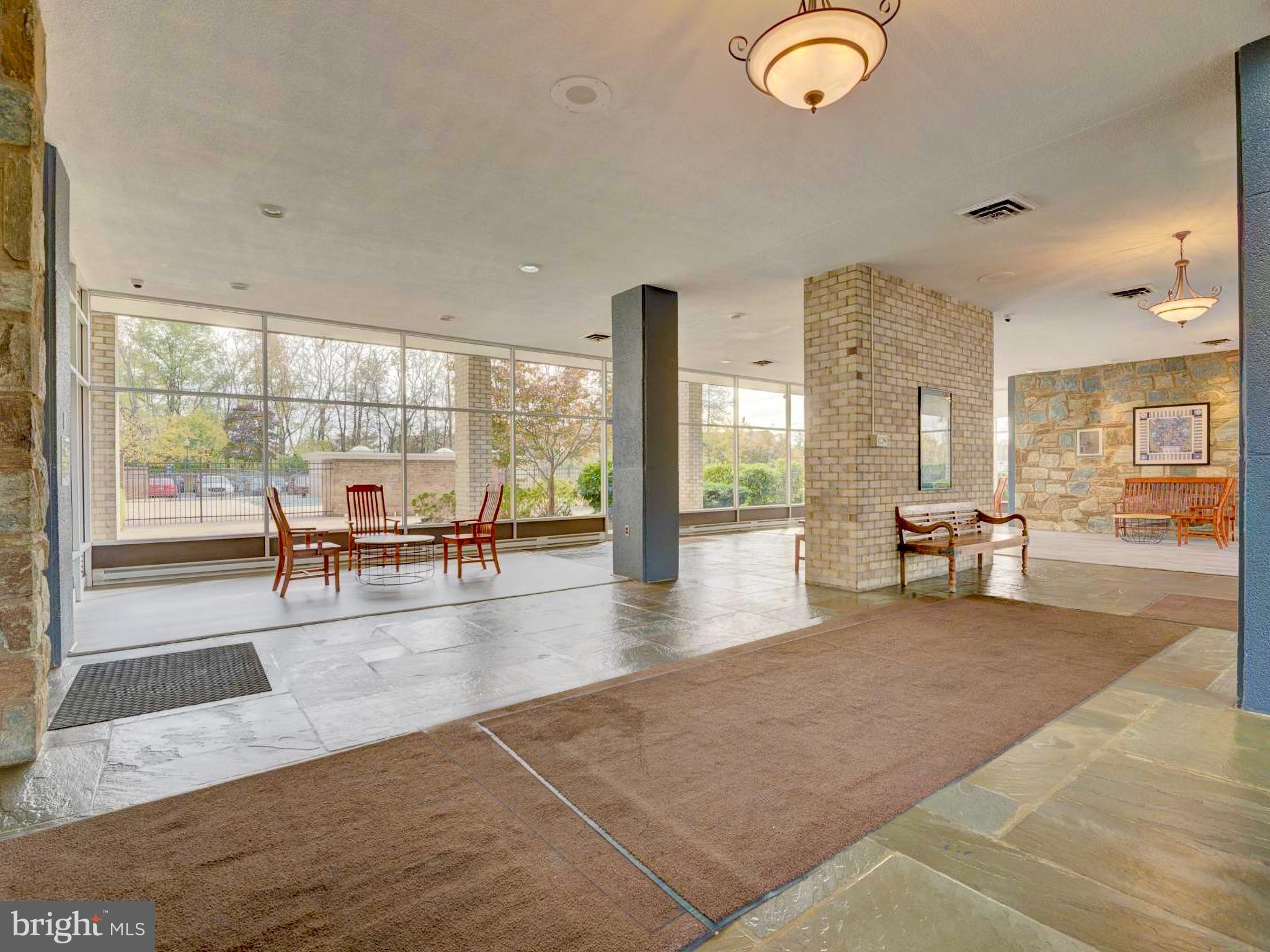 3245 Rio Drive, Unit 206 Falls Church, VA 22041 - Photo 32 of 36 a view of a living room and floor to ceiling window or wooden floor