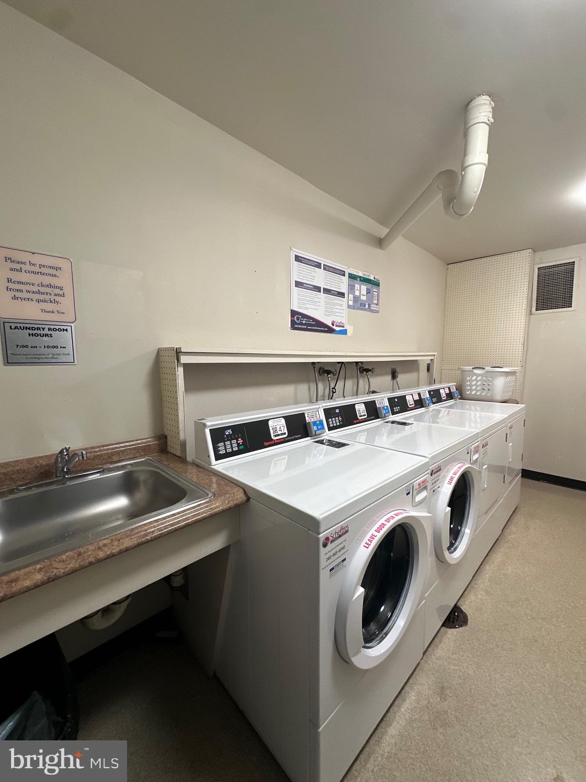 3245 Rio Drive, Unit 206 Falls Church, VA 22041 - Photo 34 of 36 a utility room with washer and dryer