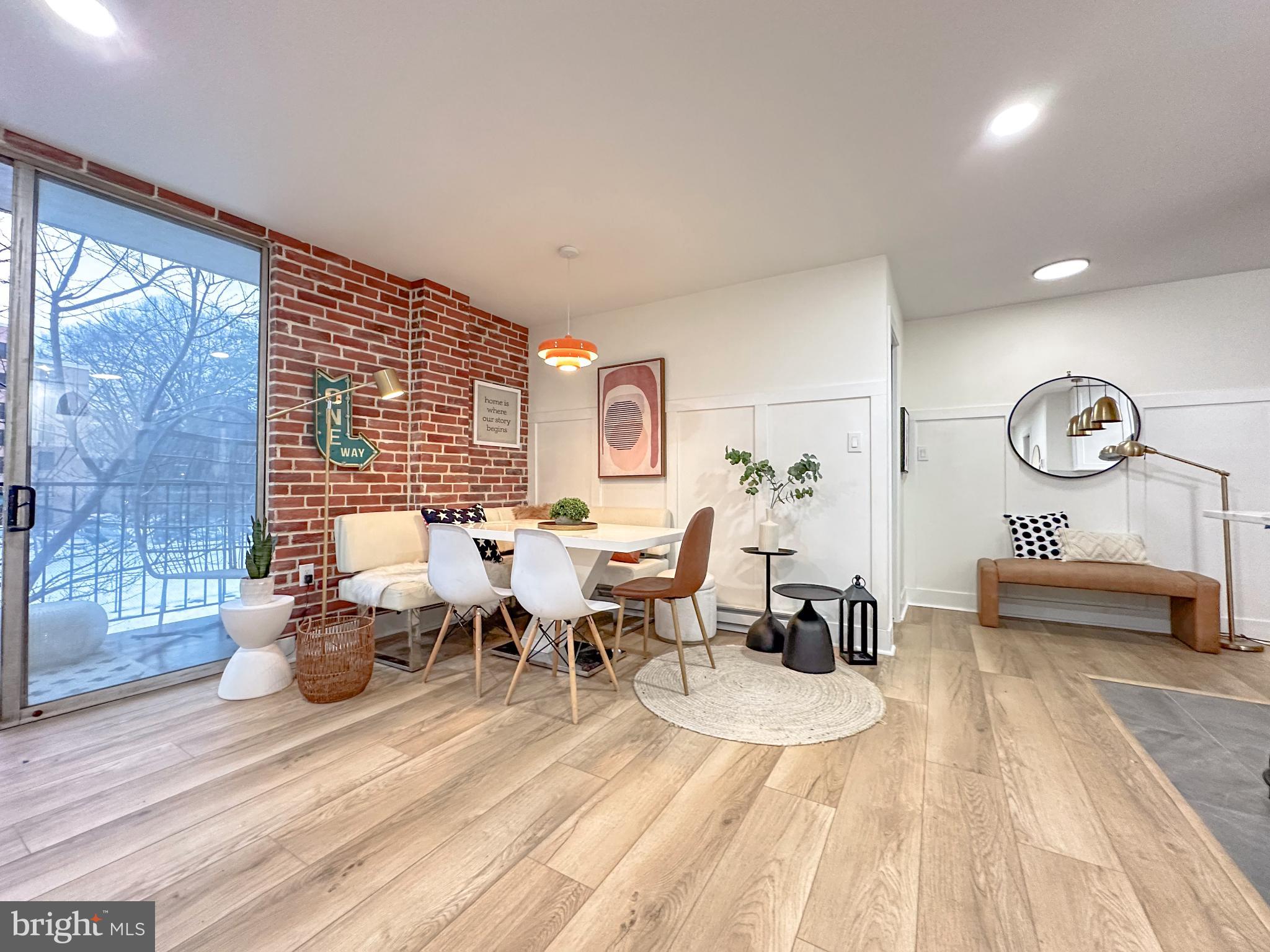 3245 Rio Drive, Unit 206 Falls Church, VA 22041 - Photo 5 of 36 a living room with lots of furniture and painting on the wall